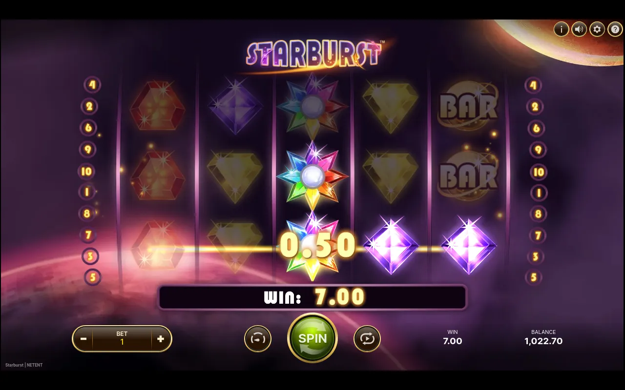 A 7.00 win on a line of purple gems with the rainbow Starburst Wild expanded across the centre reel